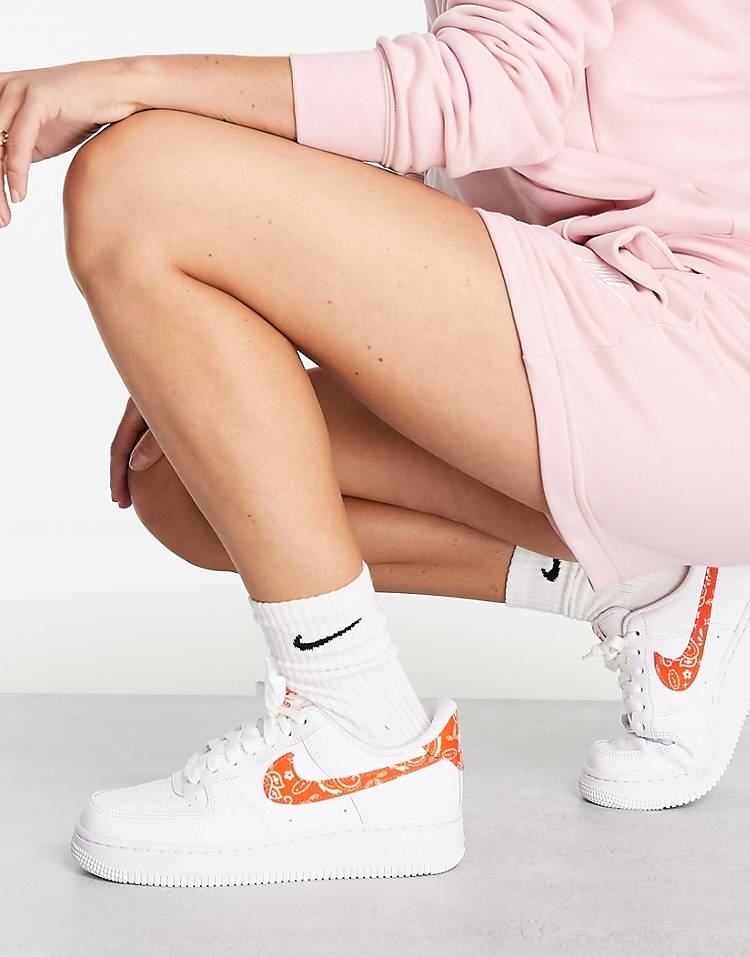 Nike Air Force 1 '07 ESS sneakers in white and orange